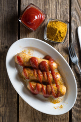 Curry wurst. German sausages with ketchup and curry