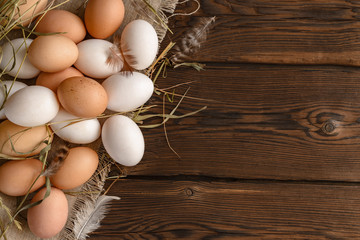 top view lots of white and brown eggs on canvas.