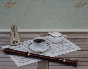 English teacup with saucer and cream jug, fine bone china porcelain, metronome for music and a...