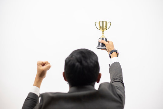 Businessman holding star award in business concept