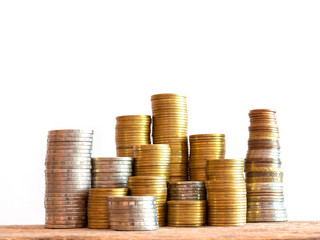 Coins stack on wooden table and white background, Invest your money to get in come,growing business...
