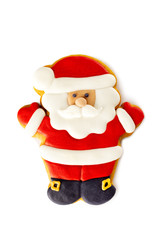 Closeup image of red Santa Claus gingerbread xmas cookie isolated at white background.