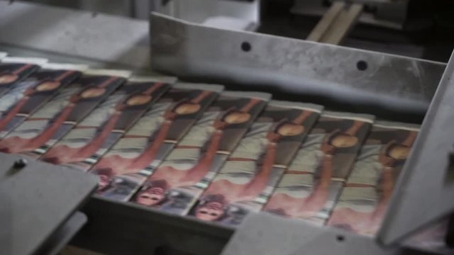 print plant factory, magazine transports on conveyor belt line after printing units and folder