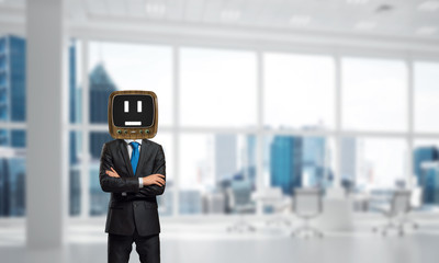 Businessman with old TV instead of head.