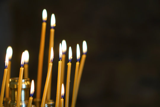 lit candles in a church in Greece