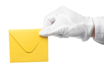 Closeup of a butler holding an envelope. man is unrecognizable