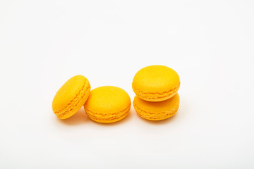 yellow macaroons on white background