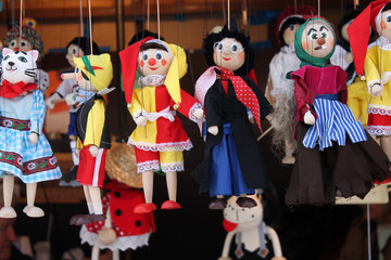 Traditional czech wooden puppets for sale closeup .