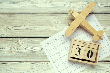 June 30th. Image of june 30 wooden color calendar on wooden background. Summer day