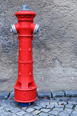Fototapeta na wymiar powerful modern street hydrant to extinguish a fire in the German city of Fissen