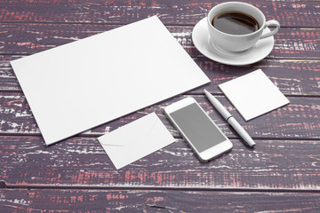 Obraz na płótnie Canvas Branding stationery mockup on purple desk. Top view of paper, business card, pad, pens and coffee.