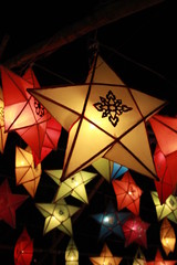 Traditional Northern Thai lanterns displayed colorfully hanging in the night sky during a cultural festival, Thailand, Southeast Asia