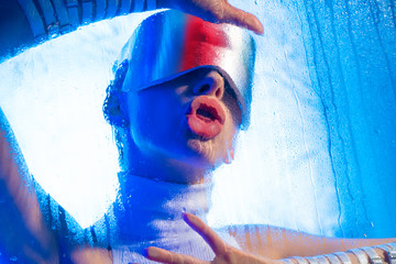 Girl with virtual reality glasses drinking water