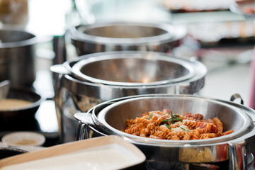 scooping the food, buffet food at restaurant, catering 