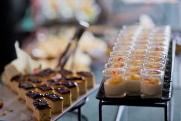 Glass shots pastry, wedding catering food, mini canapes food, tasty dessert, Beautiful decorate catering banquet table,  snacks and appetizers, wedding celebration