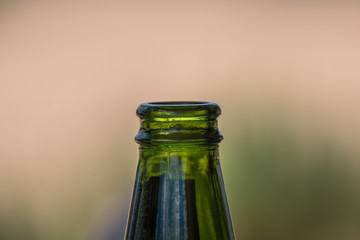 Closeup of green glass bottle neck