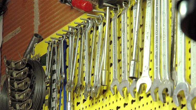 Collection Of Wrenches Hanging On The Wall.