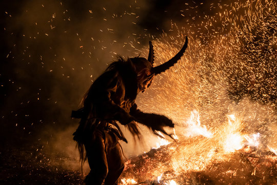 The Krampus masks in an exhibition in the night in Tarvisio, Italy