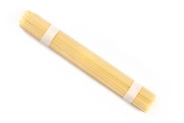 A photo of an individual portion of udon noodles, shot from the top on a white background with copy space