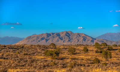 West Mountain against a brilliant blue sky in Utah