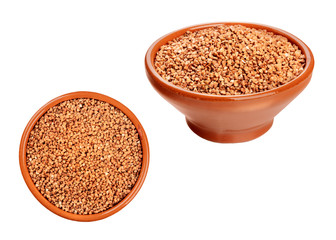 Photos of dry buckwheat in earthenware bowls, angle and overhead views, isolated on a white background