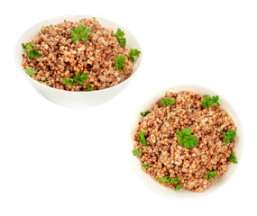 Cooked buckwheat garnished with fresh parsley, overhead and angle views, isolated on a white background