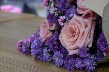 Bouquet pink rose and purple flower.
