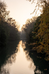 Autumn sunset during the navigation of a small river