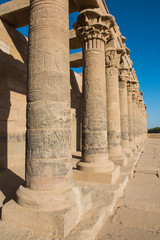 Hieroglyphic carvings on columns at an ancient egyptian temple
