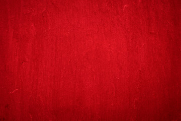 Old red dirty wall background with vignette