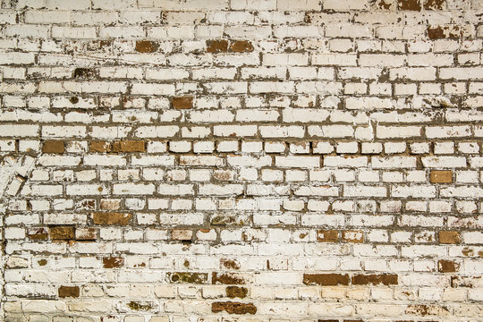 Loft style white brick cracked wall background