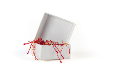 White box with saffron red gold of sardinia inside isolated on white background