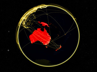 Australia on dark Earth with networks. May be representing air traffic, telecommunications or other communication network.