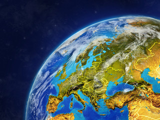 Europe on model of planet Earth with country borders and very detailed planet surface and clouds.