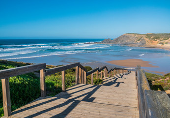 Wooden footbridge to beautiful beach