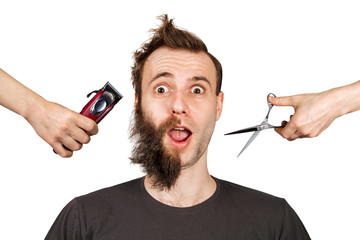 hand with clipper and hand with scissors cut overgrown unshaven guy with a beard on a white...