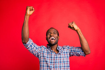 Portrait of nice handsome attractive cheerful glad positive guy wearing checked shirt showing...