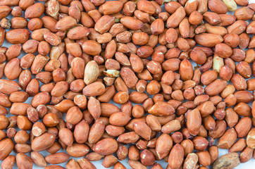 Dried and beautifully lying peanuts on a white background.