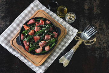 Delicious string beans with bacon in a cast iron skillet.