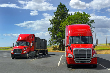 Two big red semi truck on parking © Pecold