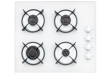 Burners on a white glass gas cooker in the kitchen. View from above. Isolated on white background.