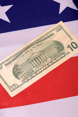 ten dollar bill in front of the American flag