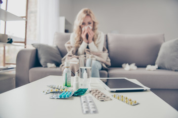 Close-up view of pile medicine colorful pills c-vitamin health support blonde girl suffering from...