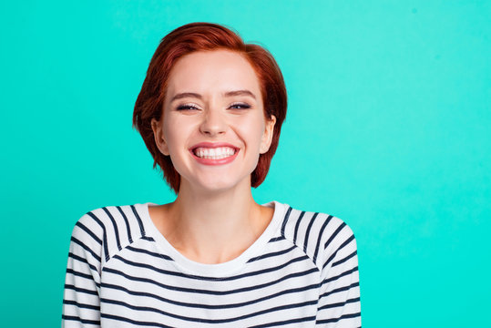 Close-up portrait of nice lovely charming attractive cheerful optimistic positive red lady wearing striped pullover isolated over bright vivid shine green turquoise background