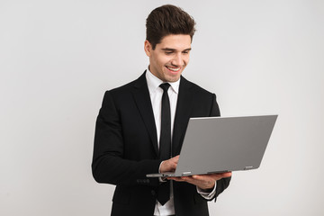 Smiling business man wearing suit standing