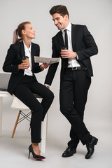 Full length portrait of a happy young business couple