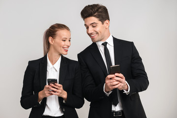 Portrait of a confident young business couple wearing suits