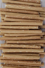 Salty stick crackers on wooden desk