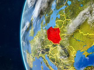 Poland from space on model of planet Earth with country borders and very detailed planet surface and clouds.