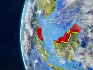 Malaysia from space on model of planet Earth with country borders and very detailed planet surface and clouds.